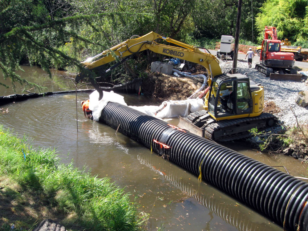 Water and fish bypass pipe on Salmon Creek